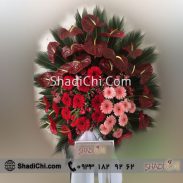 خرید انلاین تاج گل شیک با قیمت مناسب با گل های ژبرا قرمز و صورتی و گل آنتریوم مدل 4008