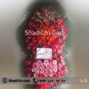 تاج گل تبریک دوطبقه با گل های قرمز صورتی و نارجی
