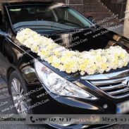 ماشین عروس مشکی با گل داوودی